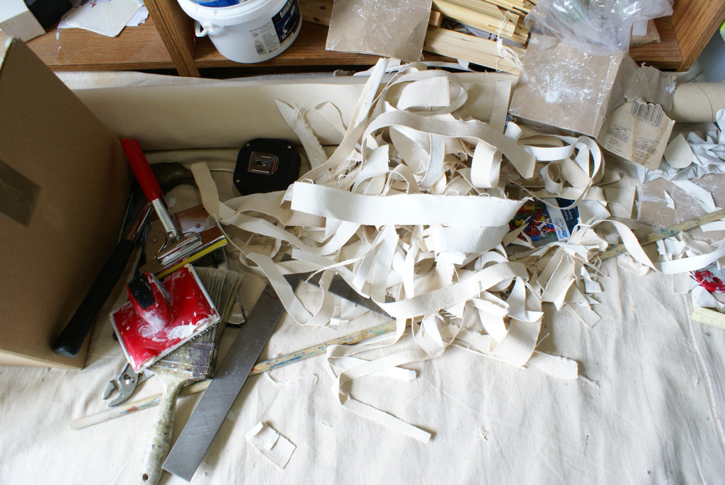 Cutting canvas cloth to size always leaves scraps of different sizes. Early on, I had experimented with assembling shapes of leftover canvas over other canvases… but it never grabbed my interest too much. Still I was accumulating boxes of scraps… What to do with them? I lost my scrap boxes in the move so - problem solved!